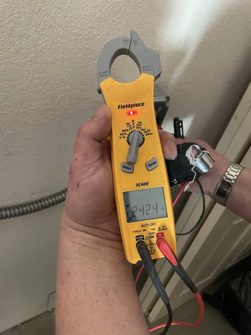 Voltage testing with clamp meter during Electrical Installation Services in Watervliet